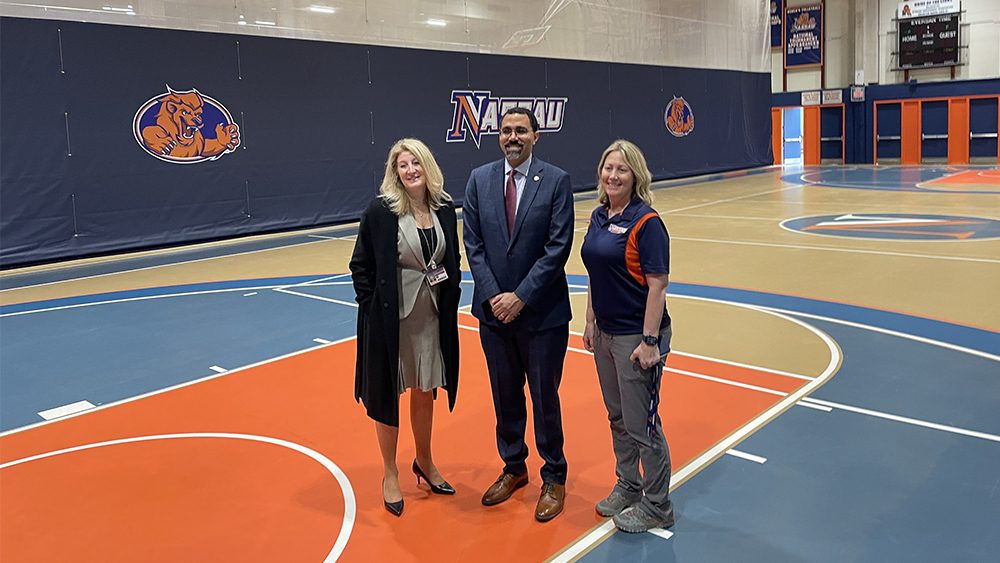 Chancellor King With Kerri-Ann and Dr. Maria Conzatti in the NCC Main Gym