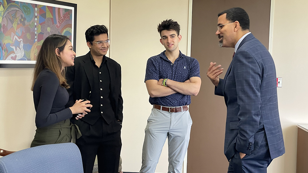 Chancellor King speaks with Tasnia Zzoha of Westbury, president of the NCC Student Government Association, Aniruddh Patel of Westbury, student representative of the NCC Board of Trustees, and NCC Class of 2023 Valedictorian Gabe Bauer of Seaford.