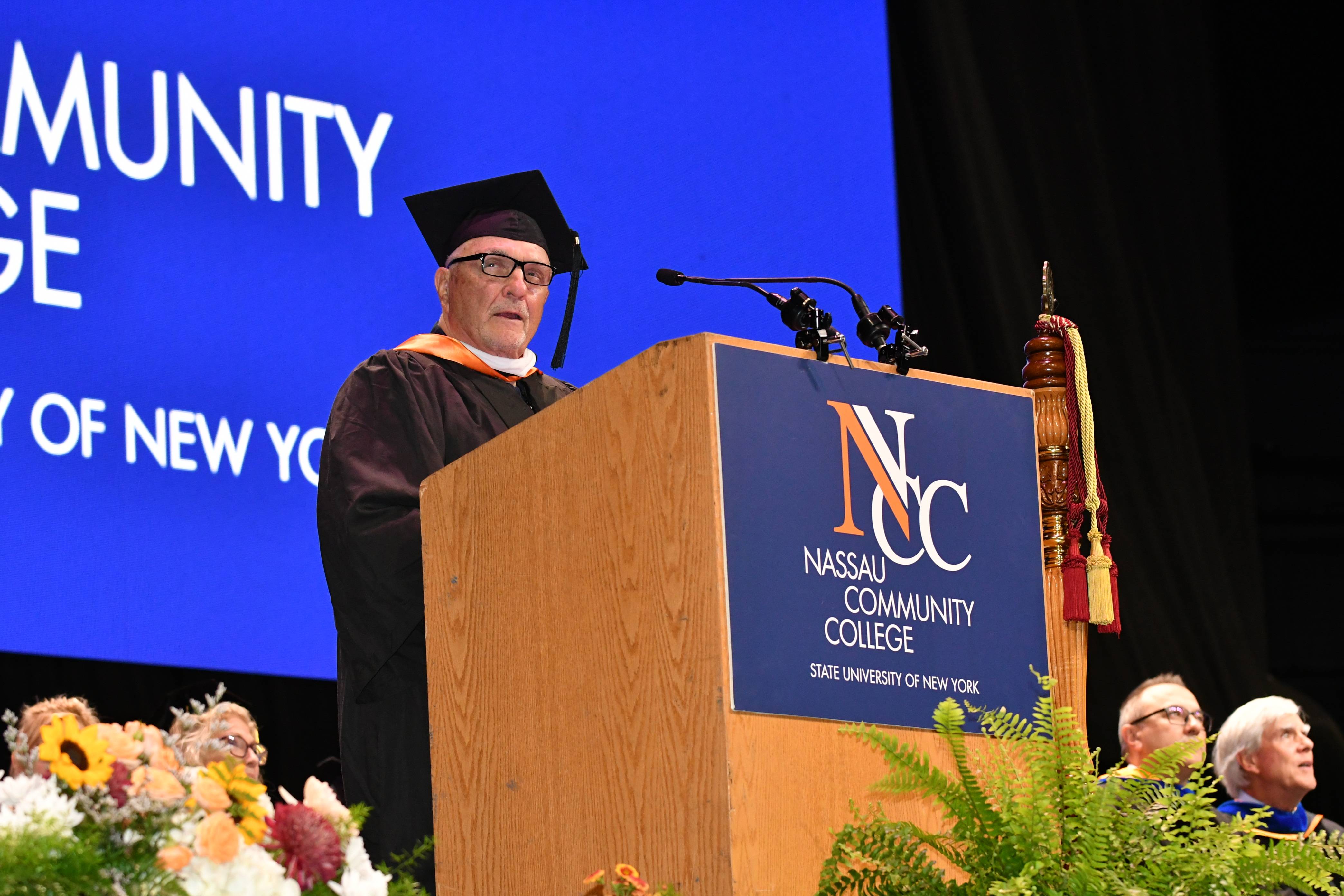 rudy speaking at commencement