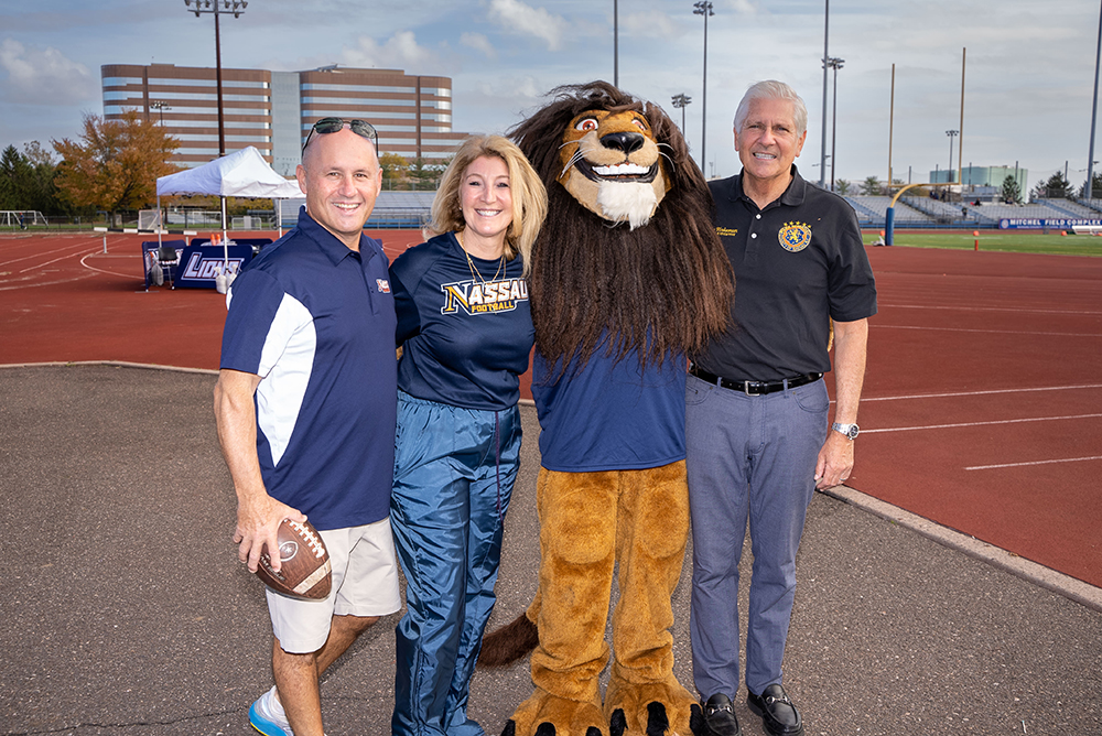 Maria Conzatti with Leo The Lion, Patrick Ryder, and Bruce Blakeman