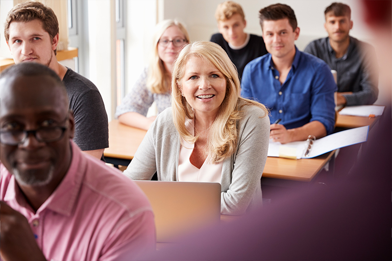 Woman in class smiling 