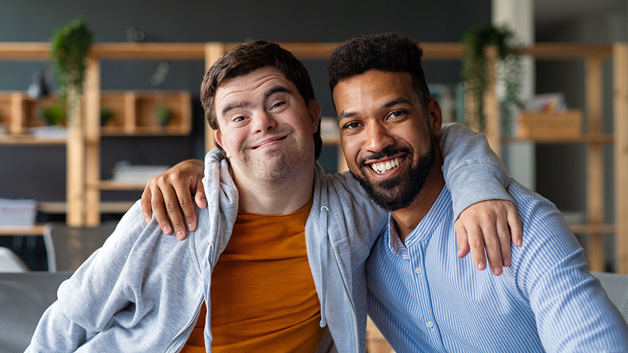 Two People Smiling To The Camera